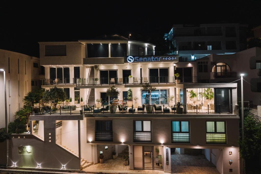 Hotel Senator Lux illuminated in the evening